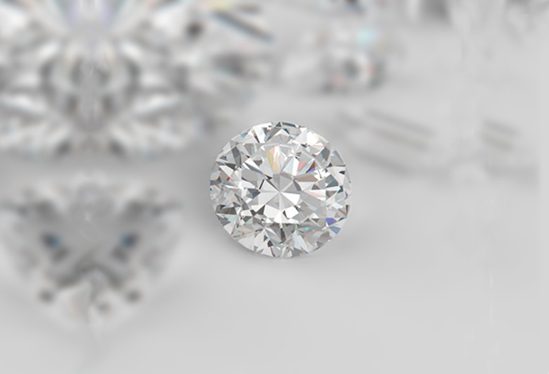 9865260 - diamonds different cuts on gray background. focus on large diamond heart shape. 3d illustration.